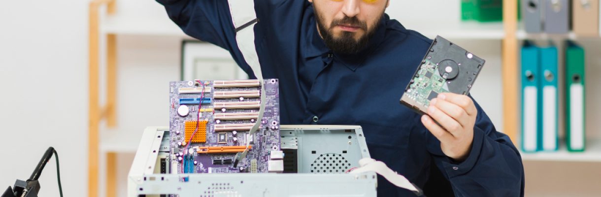 front-view-man-repairing-computer front-view-man-repairing-computer
